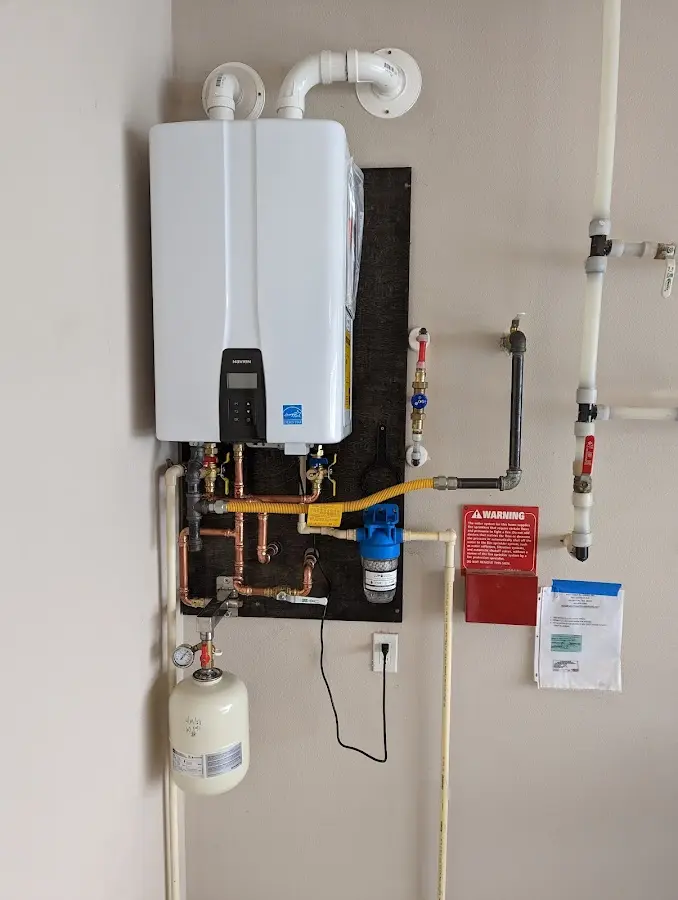 Professional plumber installing copper piping in a Altadena home